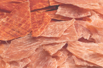 Group of tasty beer snacks. Dehydrated chicken meat slices.
