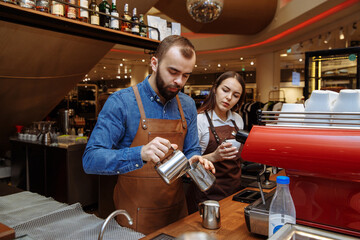 Making coffee in a coffee shop on a coffee machine