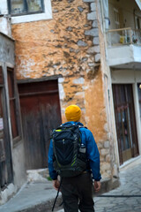 Fototapeta premium A man is travelling in the old town with a backpack.