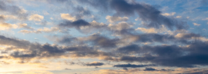 Dark clouds in the blue sky during sunset