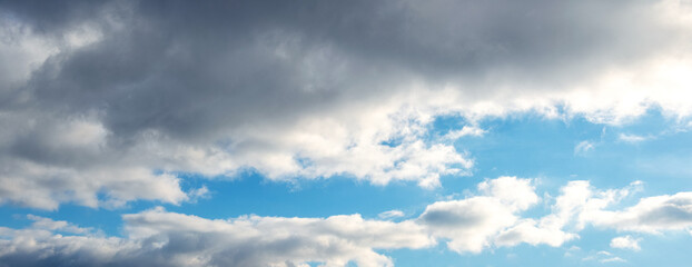 White clouds in the blue sky in sunny weather
