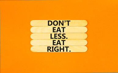 Eat less or right symbol. Concept words Do not eat less, eat right on wooden stick. Beautiful...