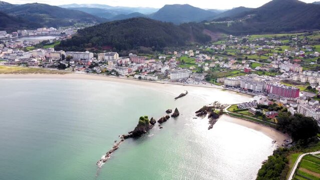 Panoramic aerial view of beautiful country side of Galicia - Spain. View of Covas city, in background is the city of Viveiro. Beautiful landscape with green fields and mountains full with trees. 