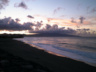 Obraz premium Beautiful sunset over beach in Ribiera Grande, Atlantic Ocean, Azores Islands.