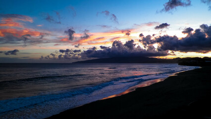 Fototapeta na wymiar Beautiful sunset over beach in Ribiera Grande, Atlantic Ocean, Azores Islands.