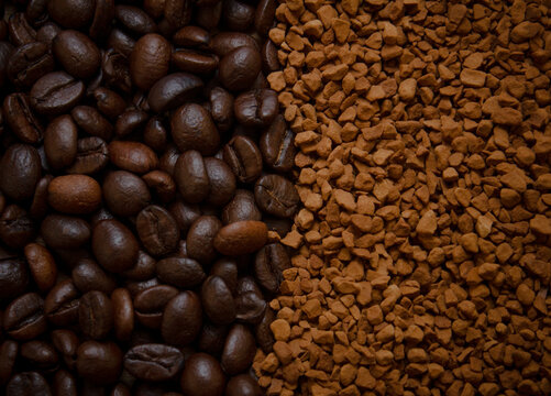 Background, top view. Combination of textures of granulated coffee and grain. Two types of coffee are poured onto the table and are combined in the middle. Coffee background of two types.