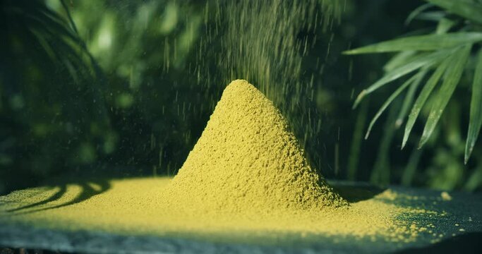 Kratom Powder on black stone in Bali Indonesia forrest