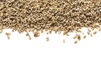 Exfoliated vermiculite mineral, isolated on white background. Mineral used in gardening