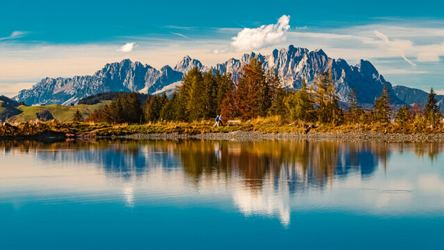 Beautiful alpine autumn or indian summer landscape shot with reflections in a lake at the famous Streuboeden summit, Fieberbrunn, Tyrol, Austria © Martin Erdniss