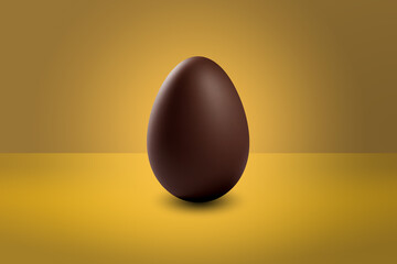milk chocolate Easter egg in front of a yellow wall and on a yellow floor