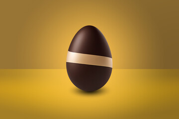 Milk and white chocolate Easter Egg in front of a yellow wall and on a yellow floor