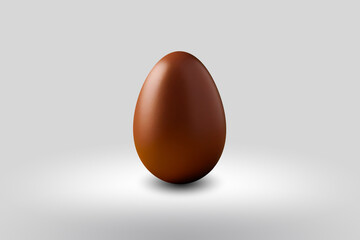 brown chocolate Easter egg on a white floor