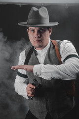 American gangster from Chicago. Early 20th century. Hat and formal suit of shirt and vest. Armed...