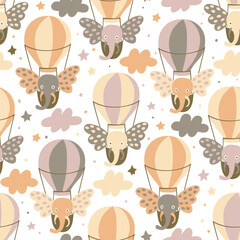 Seamless pattern with elephants flying in the sky in the hot air balloons