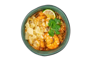 Tom Yam Kung soup with shrimps in ceramic green bowl isolated on white