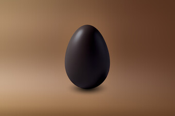 black chocolate Easter egg on a brown floor