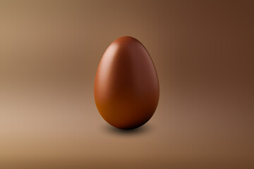 brown chocolate Easter egg on a brown floor