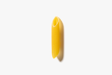One piece of pasta penne on the white background.