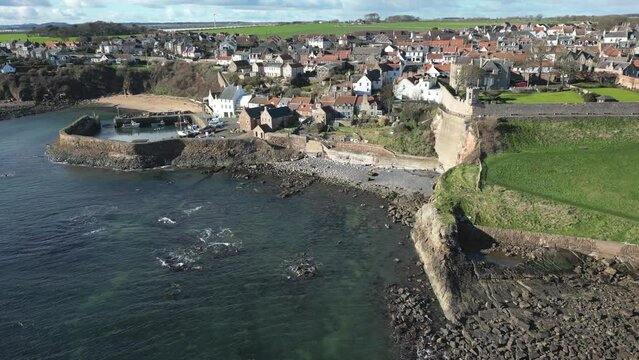 Crail, a historic fishing village on the east coast of Scotland in the East Neuk of Fife. Low level aerial footage of the pretty little harbour. 