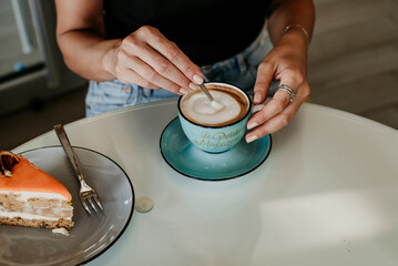 Fototapeta na wymiar woman details hands drinking coffee eating cakes and macaroons popsi nails inspo aesthetic
