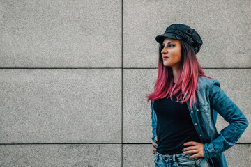 colored hair urban girl in cap looking with copy-space