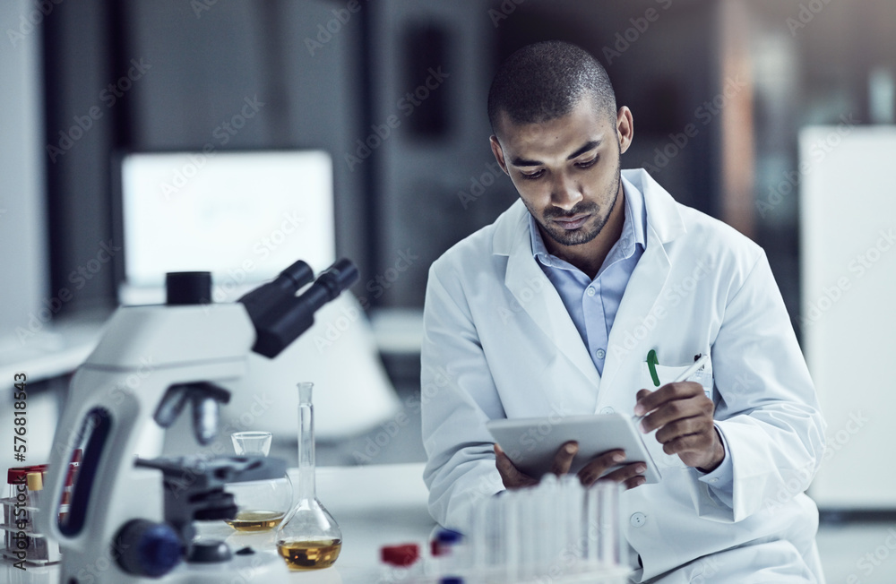 Poster asking questions and seeking answers. shot of a scientist recording his findings on a digital tablet