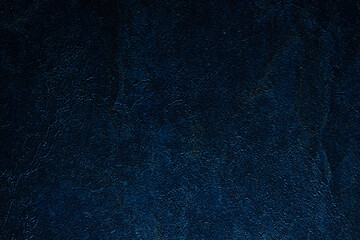 dark blue textured background, copy space