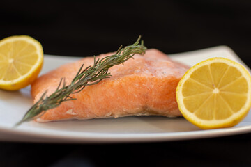 Frozen salmon steak and its ingredients for cooking lemon and rosemary