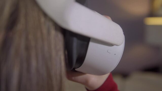 Close Up: Girl Putting on Virtual Reality Headset