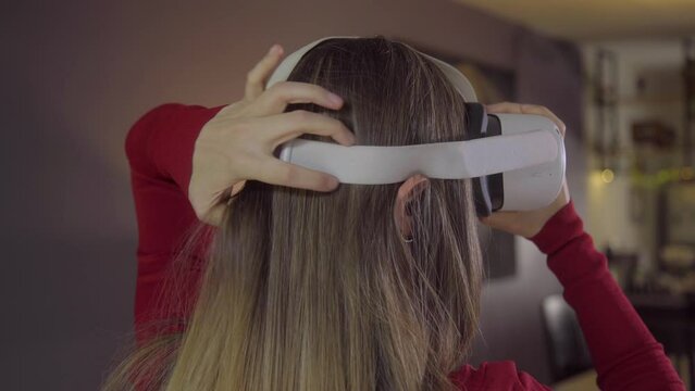 Overshoulder Shot: Girl Putting on Virtual Reality Headset 