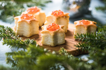 Christmas tree canape or sandwich with cucumber slice, salmon for festive x-mas snack. New year recipe