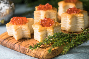 Christmas tree canape or sandwich with cucumber slice, salmon for festive x-mas snack. New year recipe