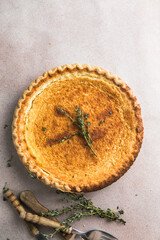 Classic chess pie pairs a traditional butter pie crust with a sweet, custardy filling in white baking dish, american cuisine