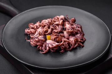 Delicious marinated octopus babies with lemon, salt and spices