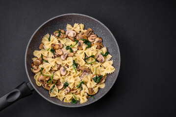 Delicious farfalle pasta with mushrooms, cheese and spinach with spices