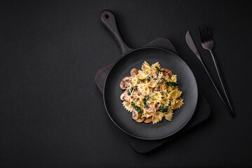 Delicious farfalle pasta with mushrooms, cheese and spinach with spices