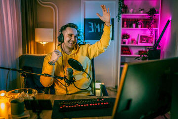 Young man male gamer playing computer game streaming video losing