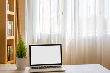 Laptop With Blank Screen On Office Table. Workspace