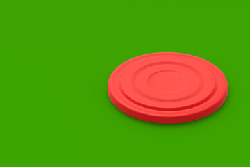 Frisbee disk on green background. Summertime vacation. Toy for game on beach. Summer leisure. Copy space. 3d render