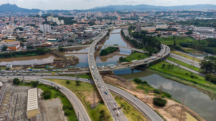 aerial view of Complexo do Cebolão is a set of bridges and viaducts in the region where the Tietê and Pinheiros rivers meet, in the city of São Paulo, Brazil. View from the bridges.
