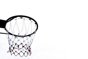 Basketball hoop viewed from below on white background, A view of a basketball hoop from below © rawintanpin