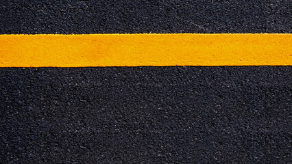 Yellow line on new asphalt detail, Street with yellow line texture