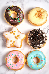 several different donuts on a white background