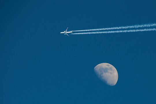 Airplane on the background of the moon