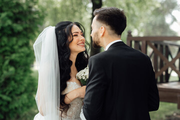 Amazing wedding couple. Beautiful bride and stylish groom.
