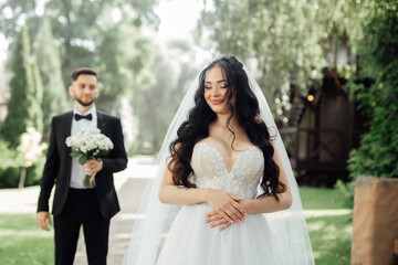 Amazing wedding couple. Beautiful bride and stylish groom.