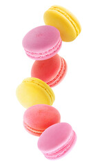 Red, pink and yellow macaroons levitating, cut out