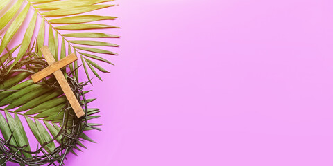 Crown of thorns, wooden cross and palm leaves on lilac background with space for text. Good Friday...