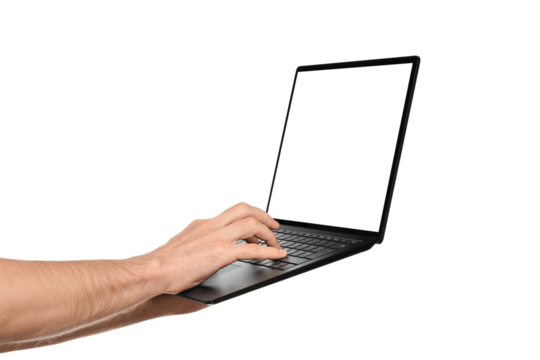 In one hand, a man holds a laptop and the other is typing text on the keyboard. Slim ultrabook in matte black with a touch screen.