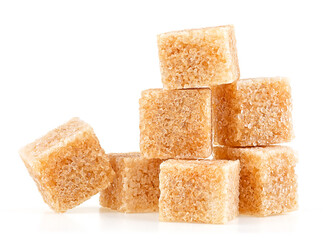 Cubes of brown cane sugar isolated on a white background